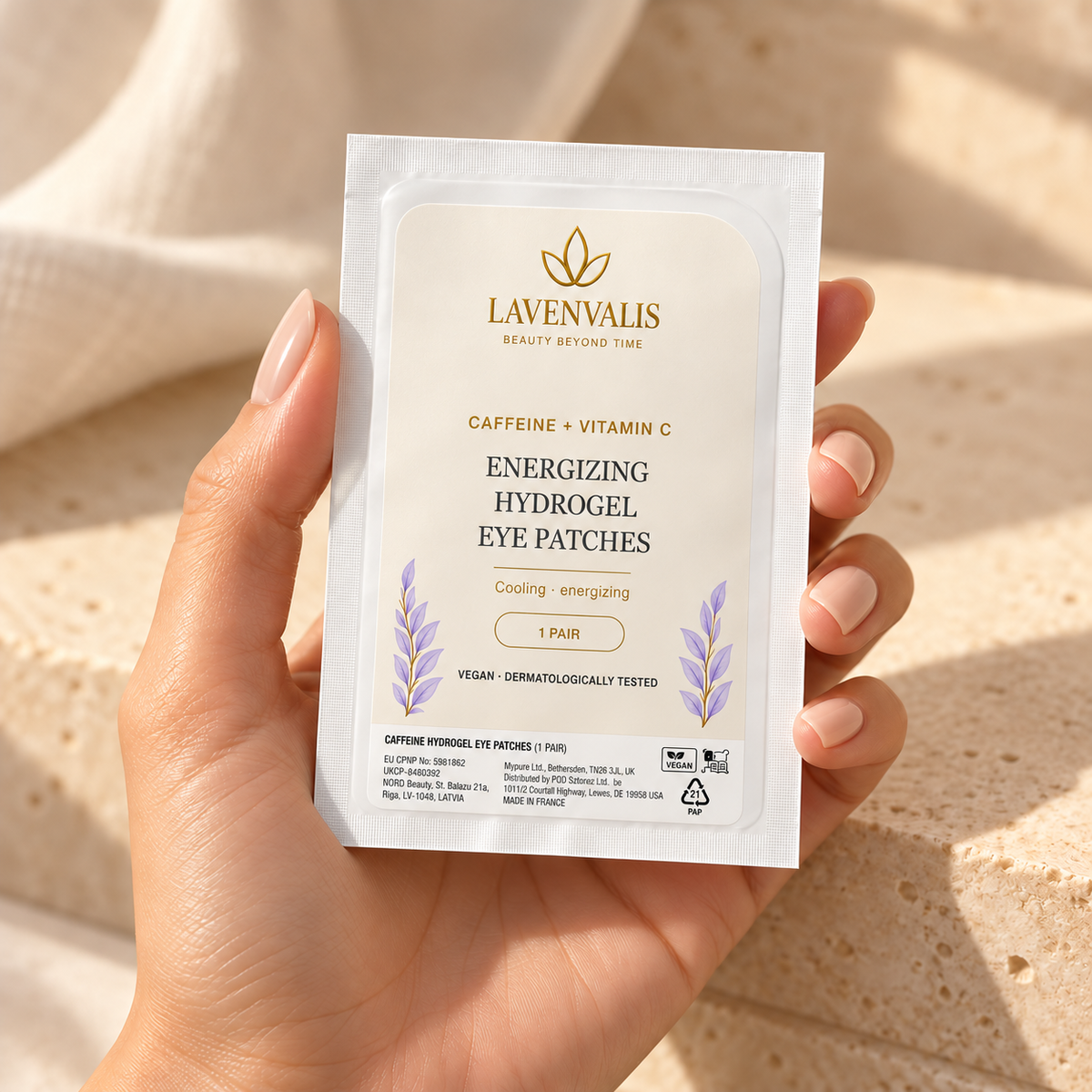Lavenvalis Caffeine + Vitamin C Energizing Hydrogel Eye Patches — individual 1-pair sachet, held in hand